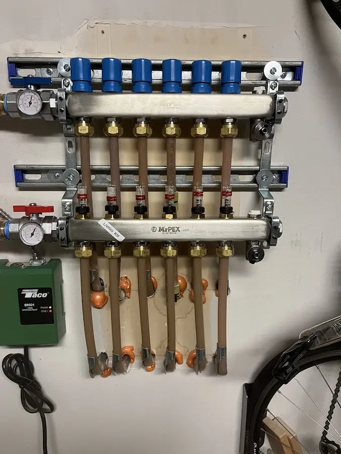 Plumber performing Gas Line Installation at a residential property in Webster City